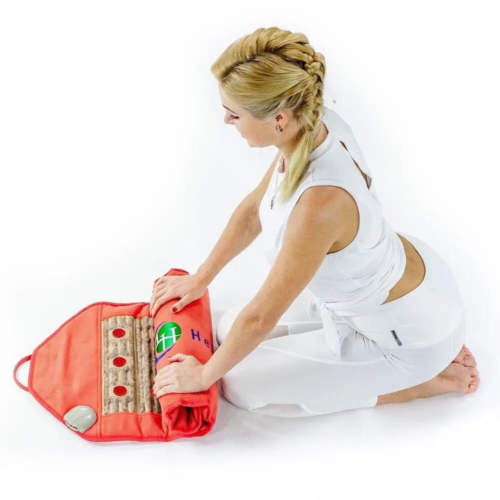Person unrolling the Amethyst Pad 3618 to reveal its red fabric and amethyst gemstone rows
