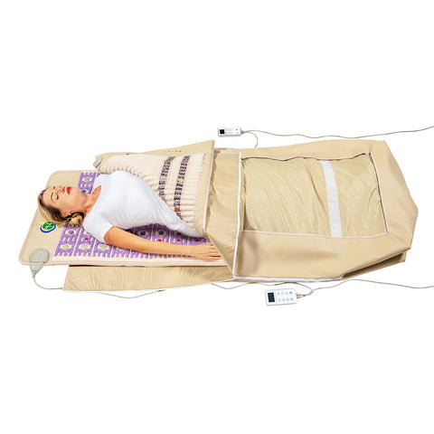 Person resting in HealthyLine TAJ 7428 Wrap Set featuring a tan gemstone SOFT mat and purple TAJ photon therapy mat.