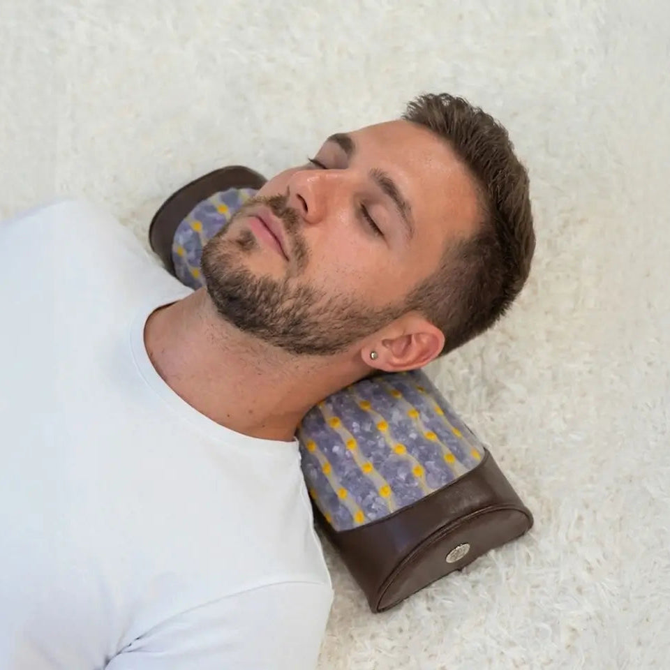A person resting on HealthyLine amethyst bolster
