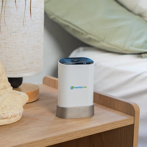 HealthyLine Portable Negative Ion Generator 50 device shown upright with USB charging cable in home set up