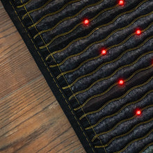 HealthyLine Jet 72x24 inch PEMF mat showing the full-length dark gemstone surface with rows of red photon lights and gold wave-pattern channels