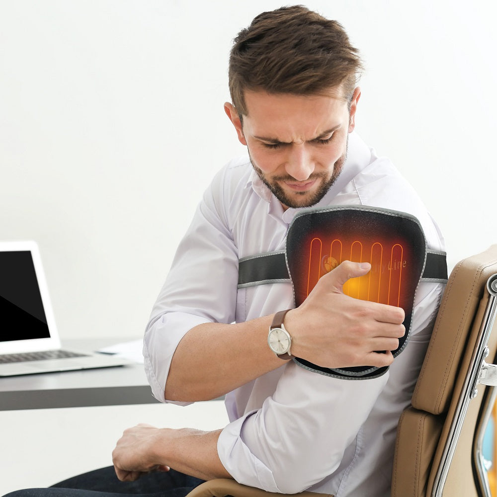 Person wearing Portable Heated Shoulder Pad draped over shoulders and neck, flexible gemstone wrap for shoulder therapy
