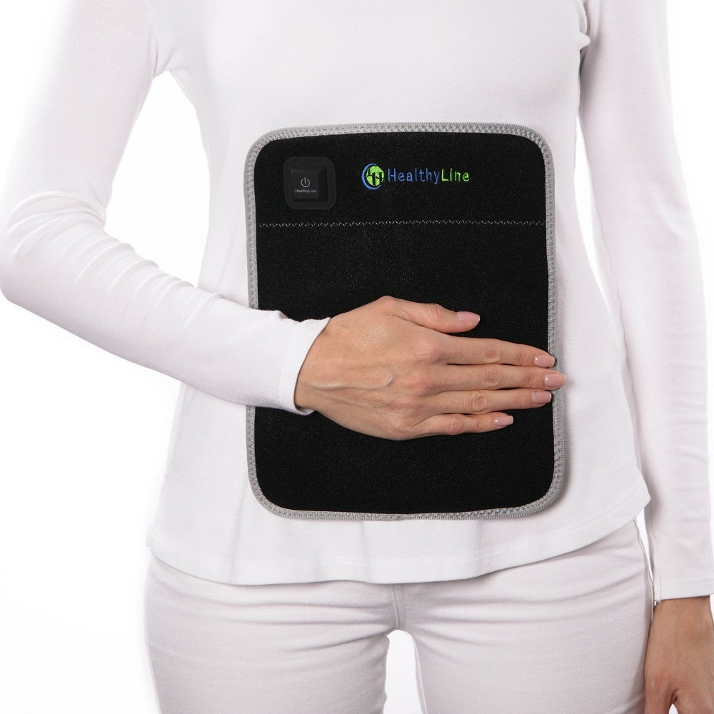 Portable Heated Gemstone Pad Flat Model  by HealthyLine in use on white background 
