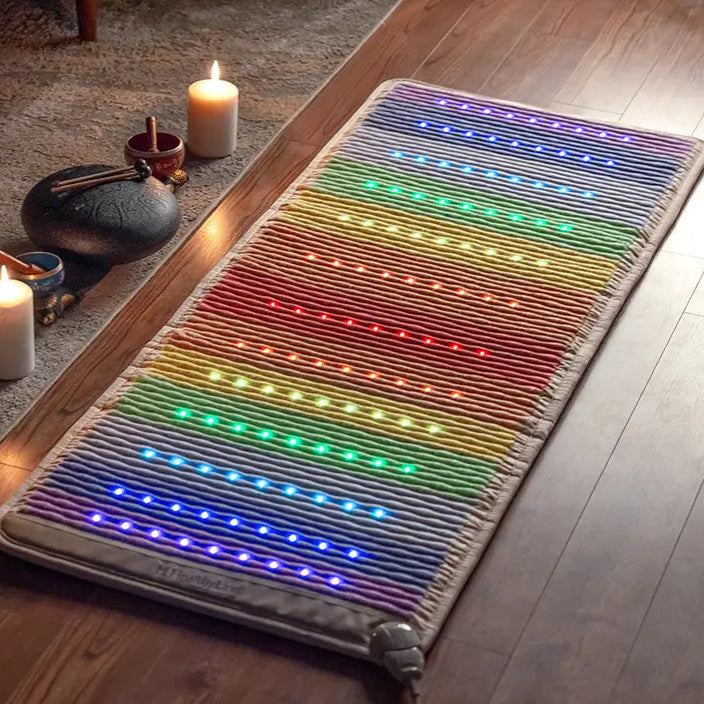 
                  
                    Rainbow Chakra 74x28 mat with 7 chakra gemstone bands laid flat, large size shown with photon lights on
                  
                