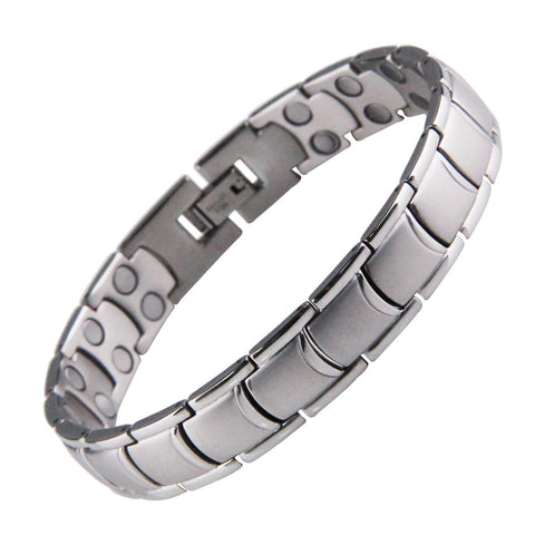 Silver stainless steel magnetic power bracelet featuring polished rectangular links and a secure clasp on a white black background