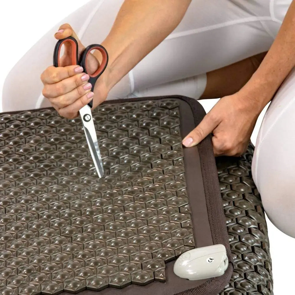Scissors testing the durable nubbed surface of the Tourmaline Pet Mat Large 5024
