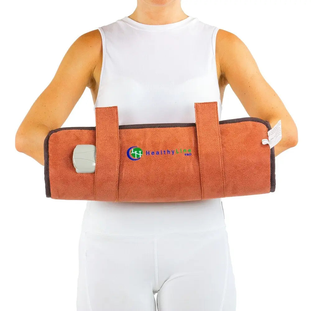Person wearing the TAO Hand wrap secured around their waist
