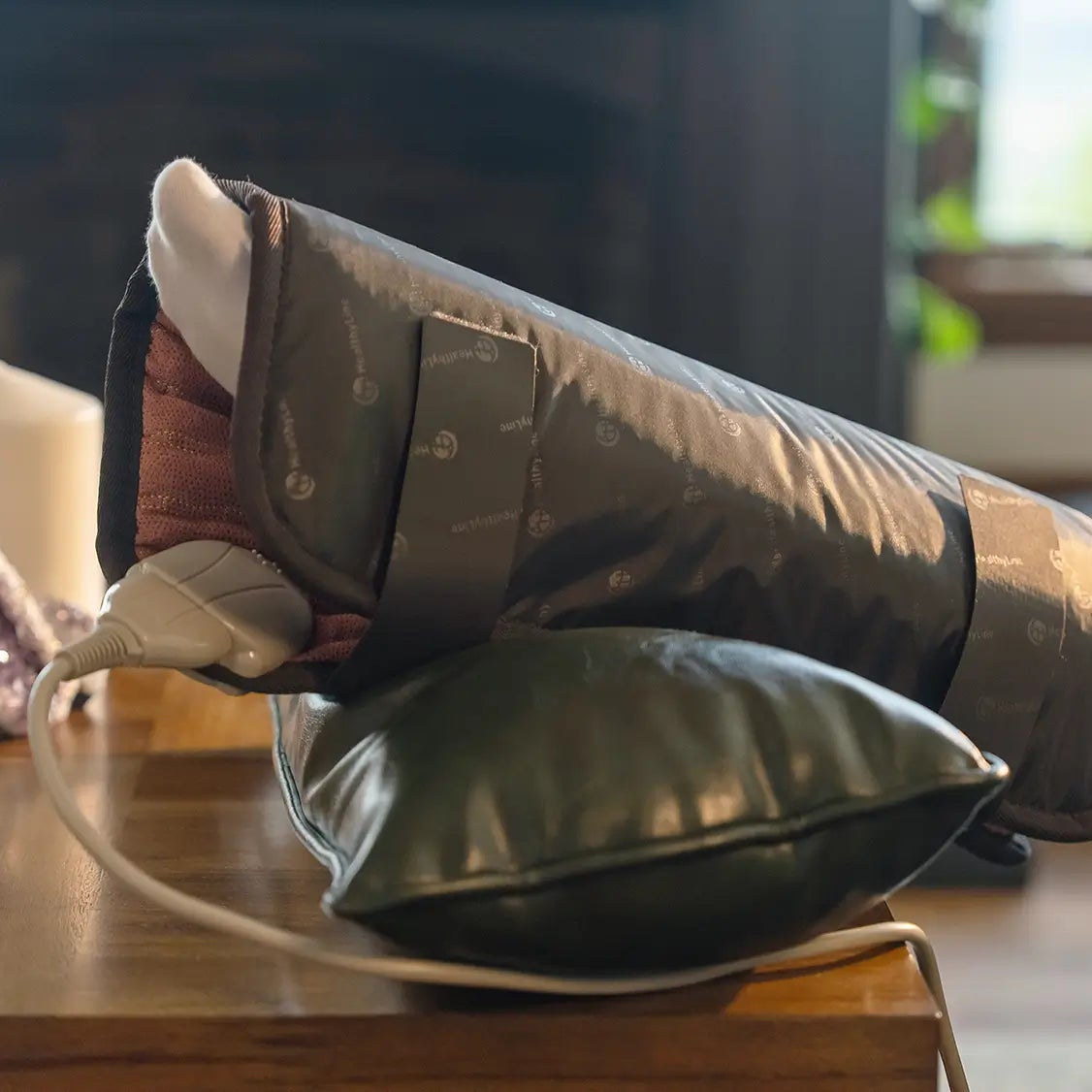 
                  
                    A TAO Mat Small 18x18 wrapped around a person's leg, secured with straps to show its flexibility and targeted heat.
                  
                